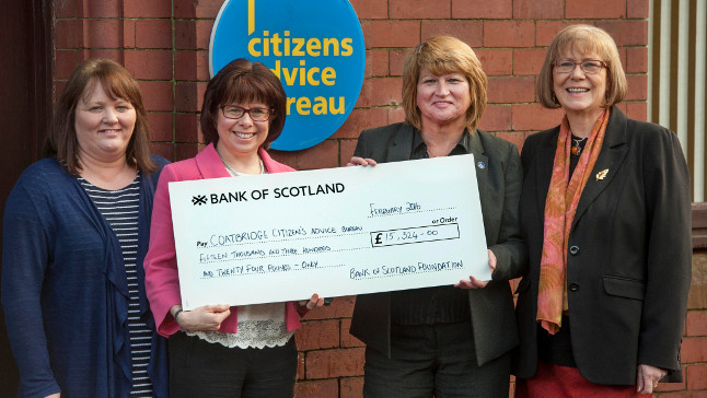 Citizens Advice Bureau staff with oversized cheque