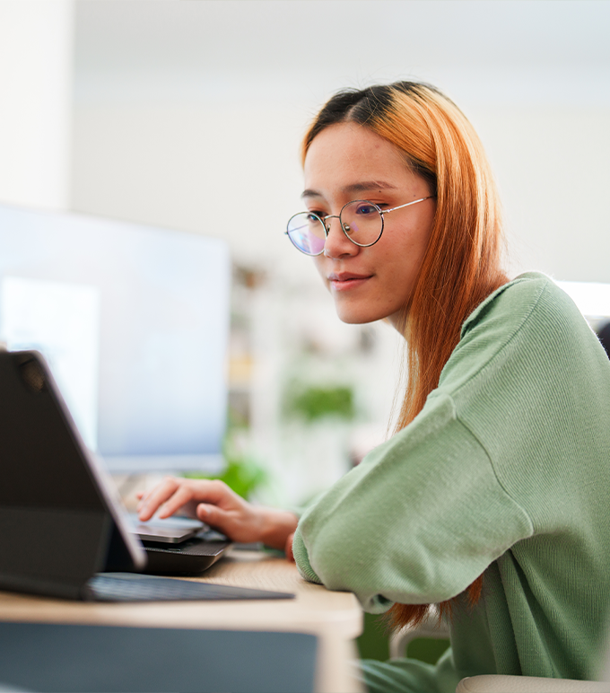 Woman looking at laptop