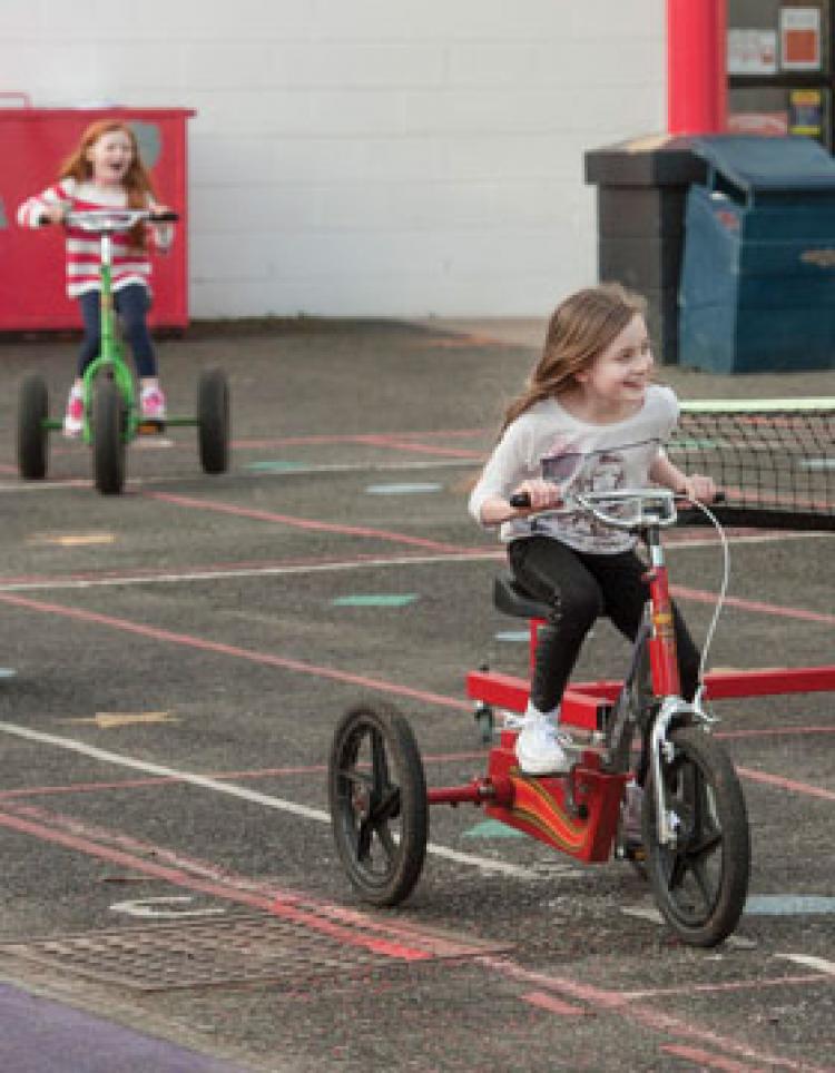 Child riding a tricycle