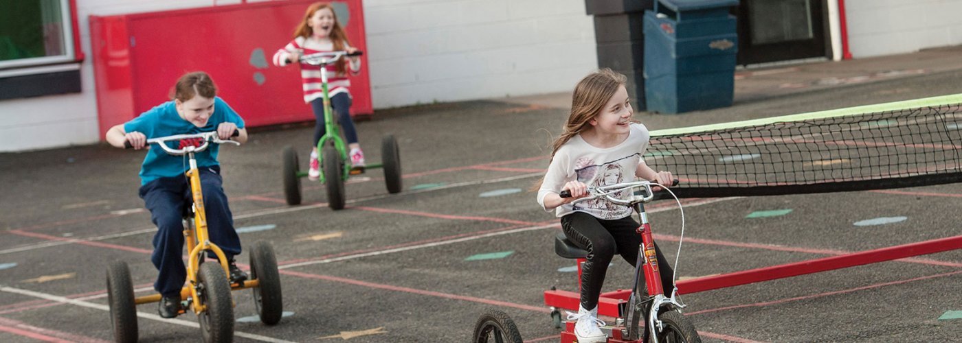Children riding a tricycles