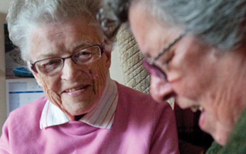 2 elderly women talking