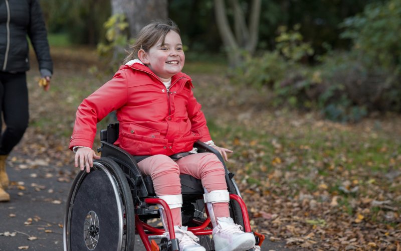 1 Child in wheelchair having fun